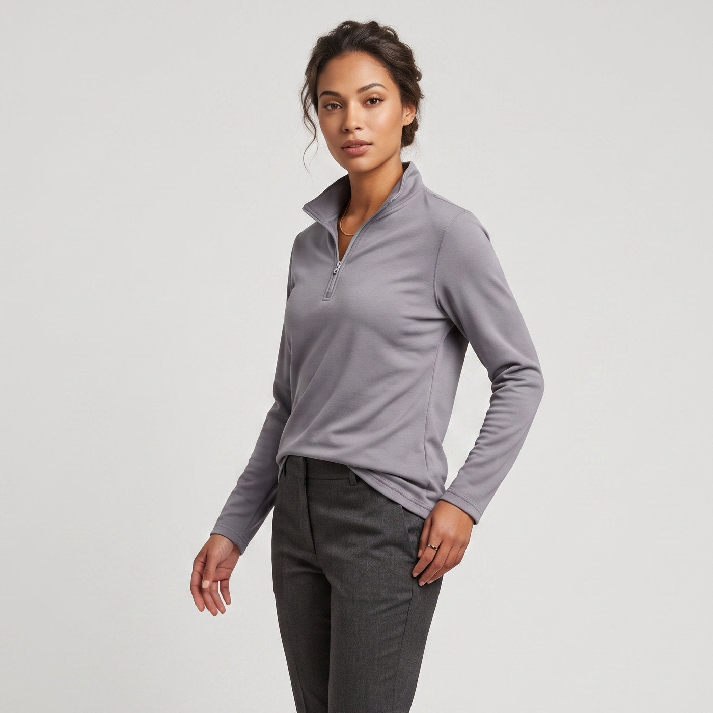 Female model wearing Iron Gray All-Season Q-Zip Pullover, minimalist blank apparel for custom branding