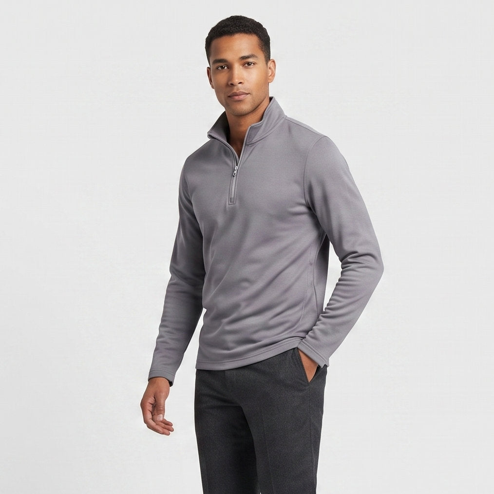Male model wearing Iron Gray All-Season Q-Zip Pullover, minimalist blank apparel for custom branding
