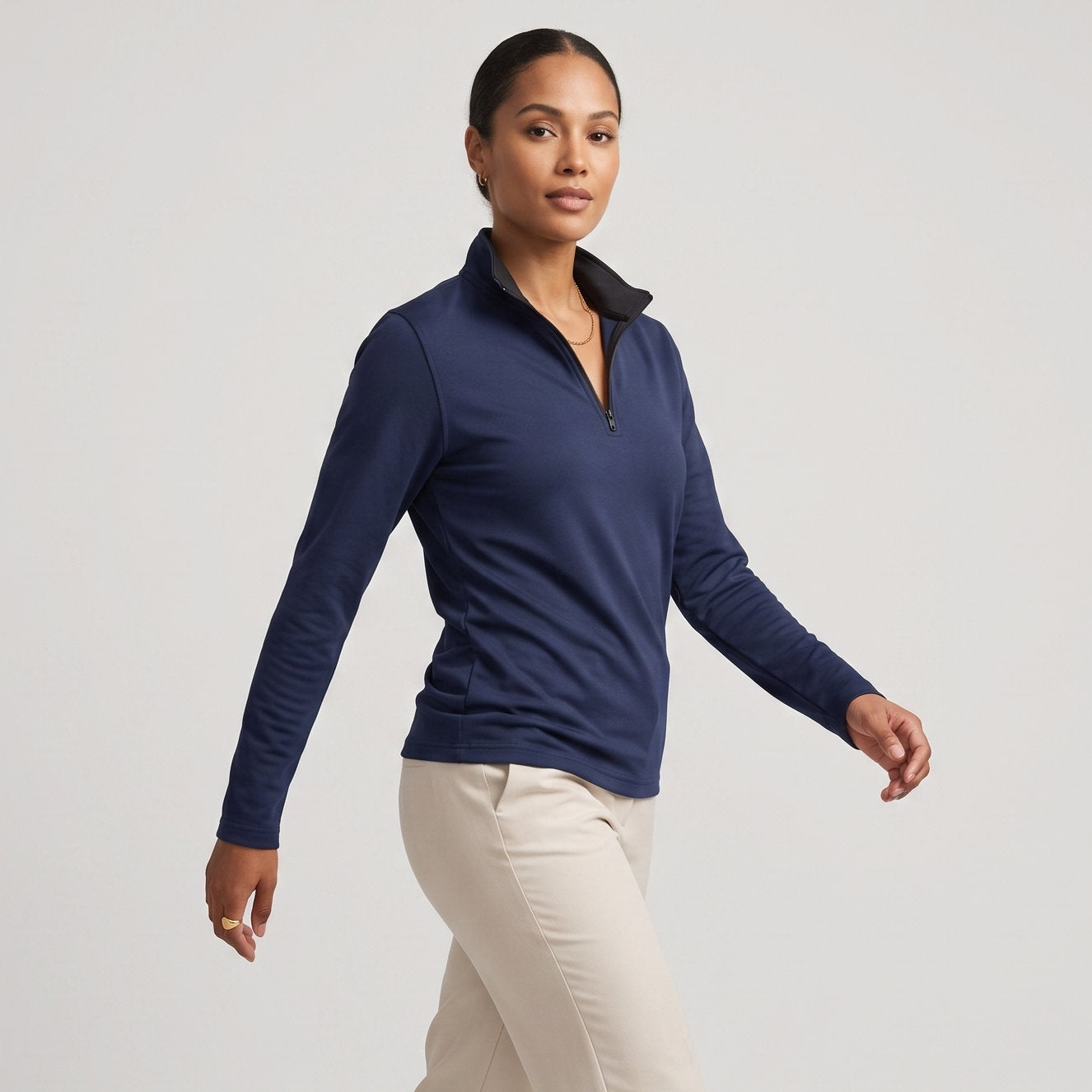 Female model wearing Navy Blue All-Season Q-Zip Pullover, minimalist blank apparel for custom branding