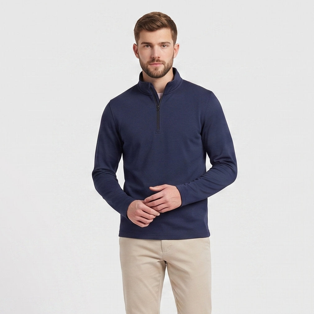 Male model wearing Navy blue All-Season Q-Zip Pullover, minimalist blank apparel for custom branding