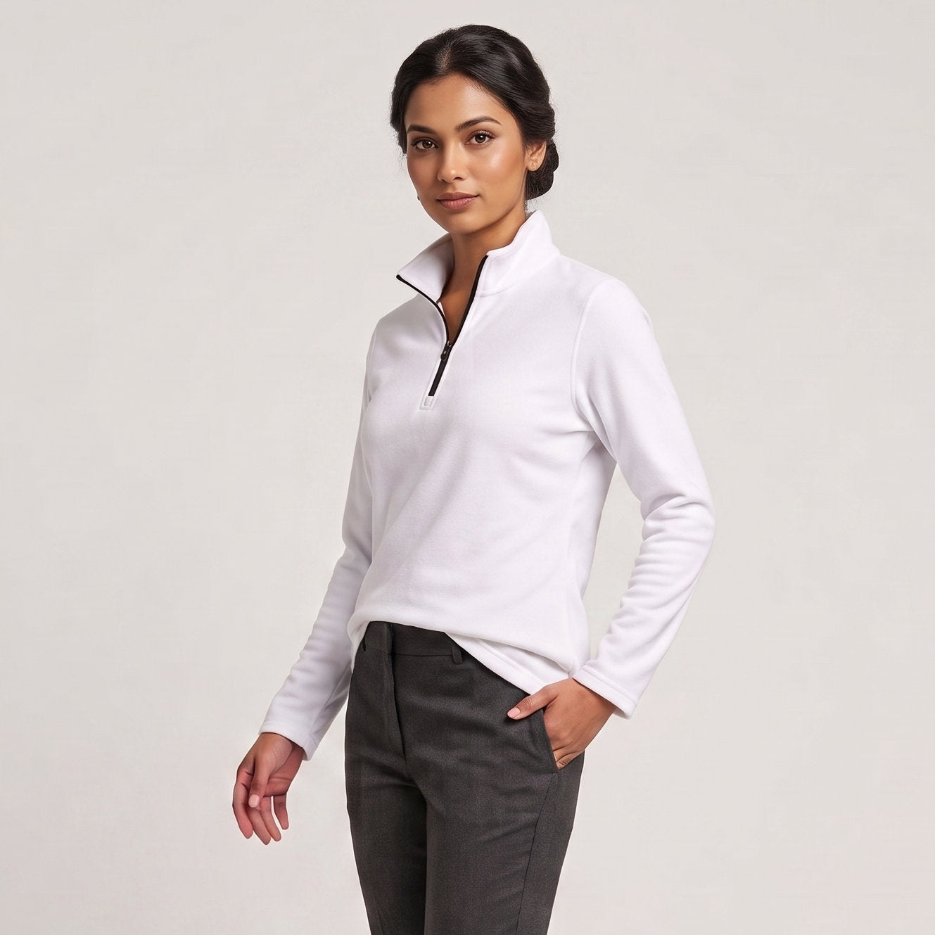 Female model wearing Optical White All-Season Q-Zip Pullover, minimalist blank apparel for custom branding