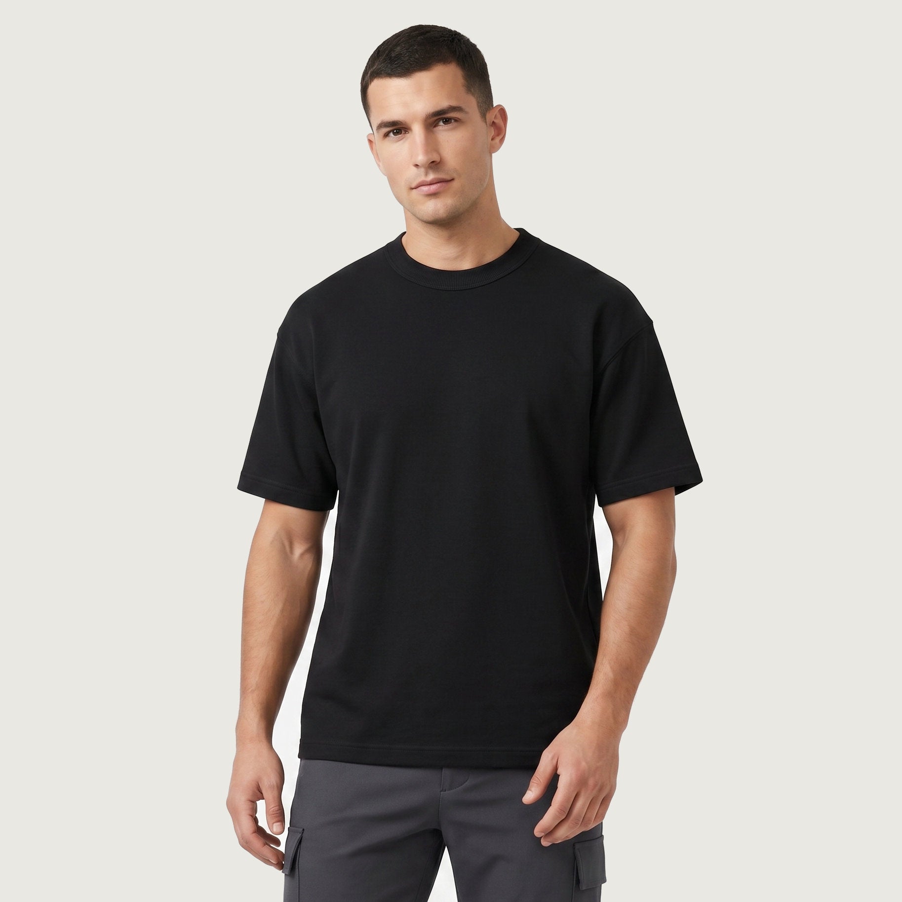 Male model wearing Obsidian Black Signature Heavyweight French Terry Tee, relaxed fit premium blank 100% cotton tee