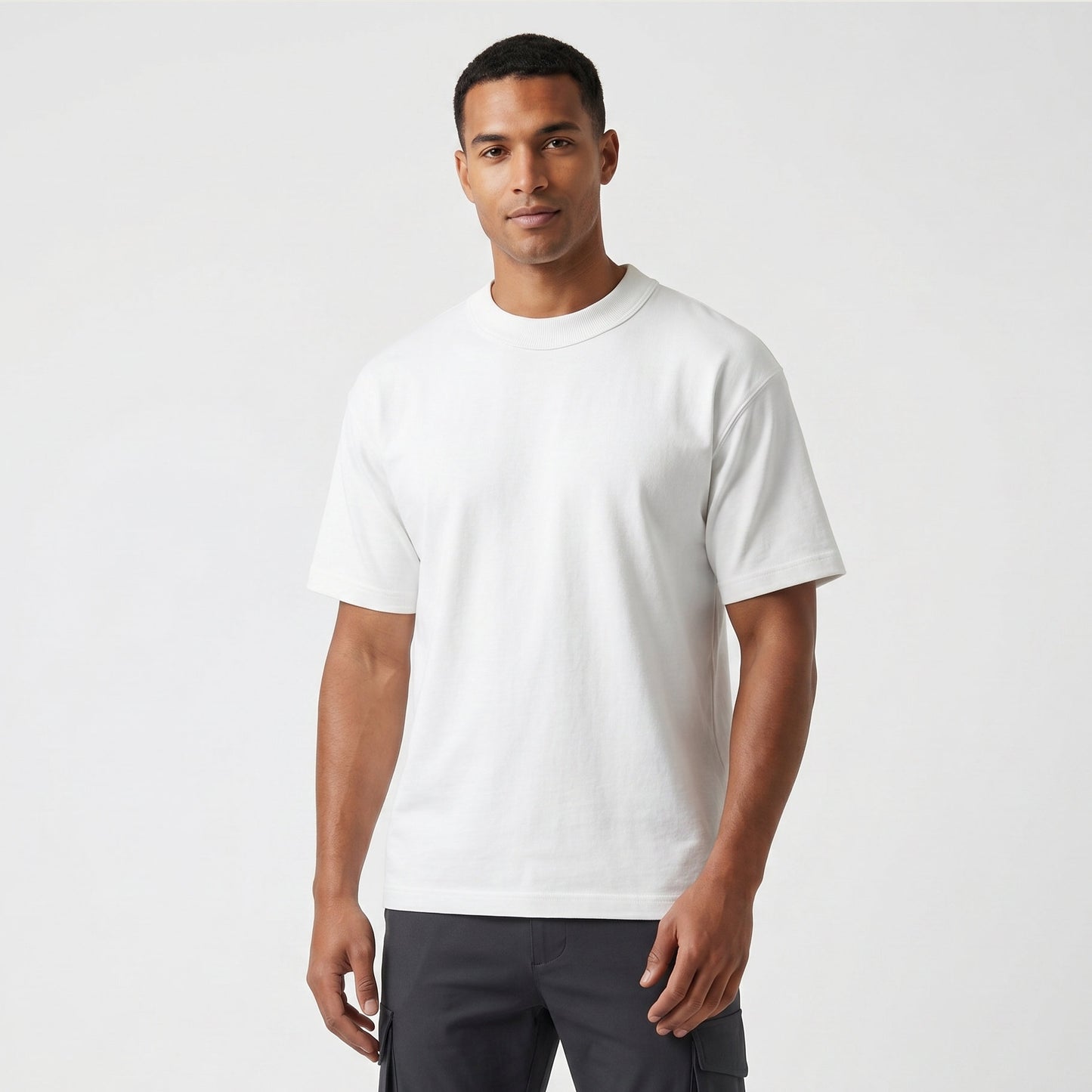 Male model wearing Optic White Signature Heavyweight French Terry Tee, relaxed fit premium blank 100% cotton tee