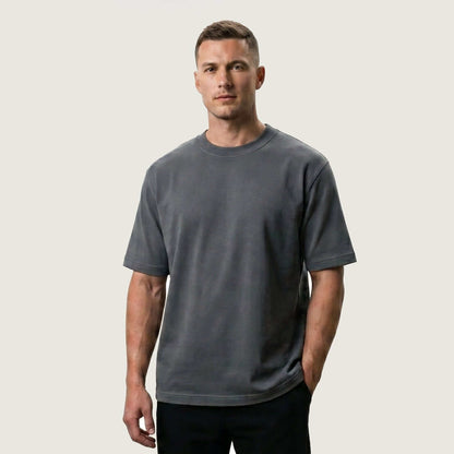 Male model wearing Iron Gray Signature Heavyweight French Terry Tee, relaxed fit premium blank 100% cotton tee
